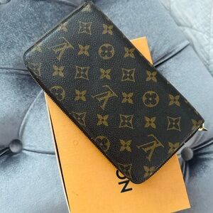 Louis Vuitton wallet with zipper never used. It is currently listed for $850.00